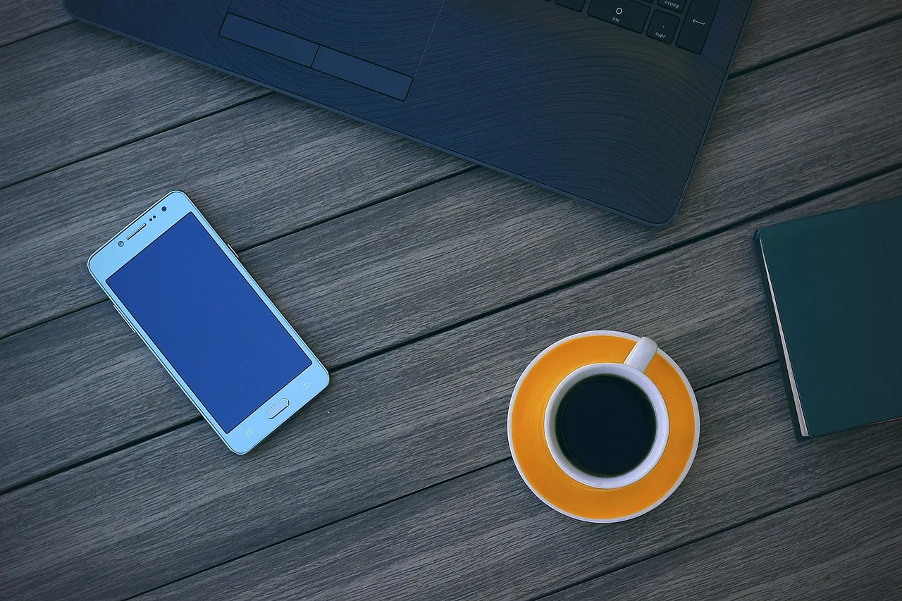 computer, cup of coffee, cellular, office, break, coffee, laptop, desk, job, table